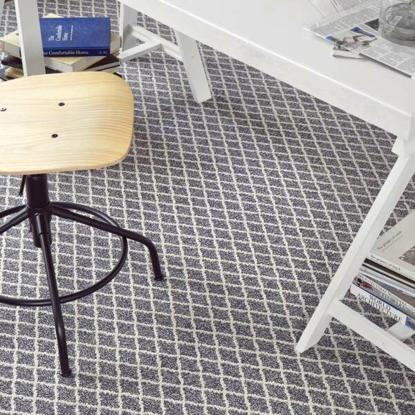 Diamond pattern carpet under white desk