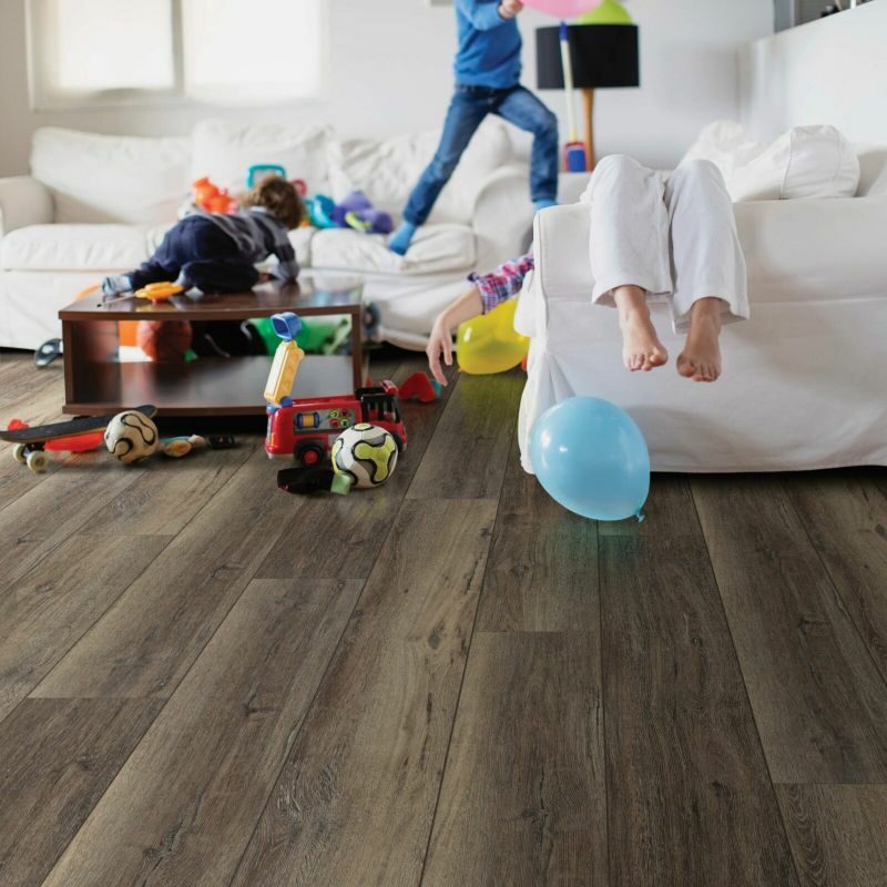 Vinyl flooring in messy living room | Off-Price Carpet Outlet